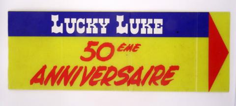 Morris (Lucky Luke) - Advertising - MORRIS - Lucky Luke - 50ème anniversaire - panneau indicateur pour le lieu de la manifestation